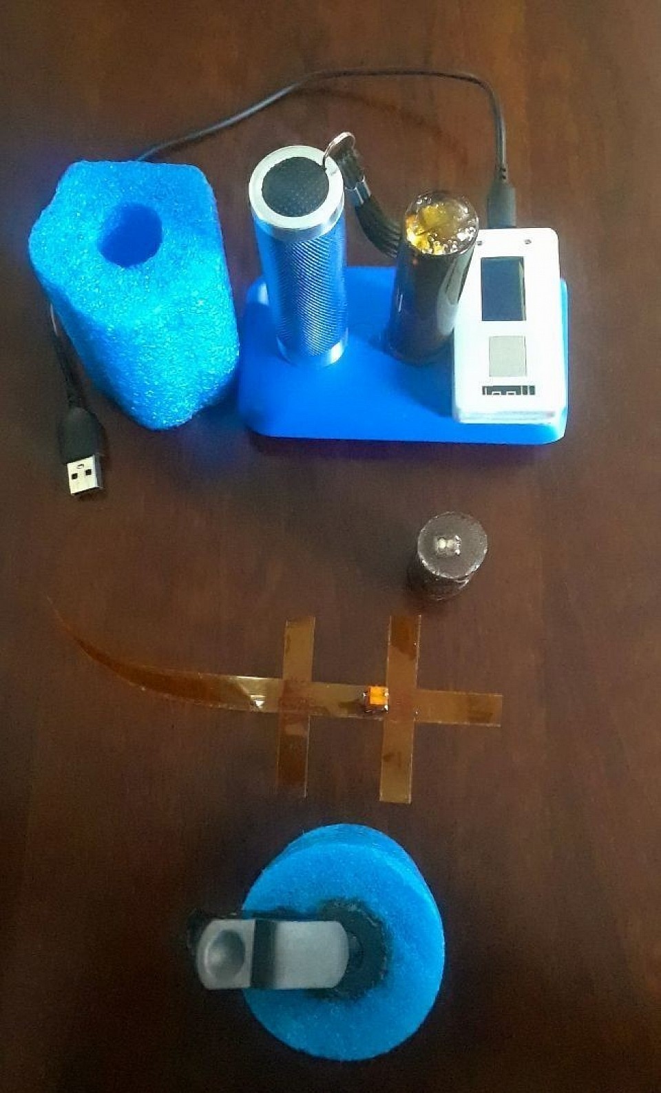 Pourrioscope evolution from 2013 to present(bottom to top). My technology has three elements: antenna- equipped Wi-fi packet, antenna equipped 'Pourrioscope' and power supply. Pourrioscope is designed, conditioned and programmed to continually shoot high frequency radio waves through any medium(space, underground) and create image of the target that is a combination of crystal structure, color structure and shape. The Wi-Fi packet acquires radio waves from Pourrioscope through their antenna in series. The resulting image is shown on the Wi-Fi packet screen as radio waves in motion moving from left to right.