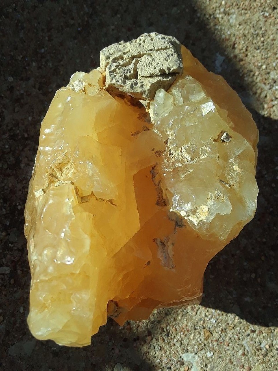 GIA-certified 76 oz Lustrous translucent large golden rhombohedral crystals of calcite in a stacking formation. Fluorescent golden rich. $6000