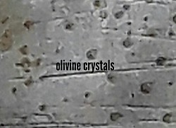 Microscopic olivine crystals post etching