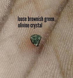 brownish green olivine crystal becomes loose after acid etching